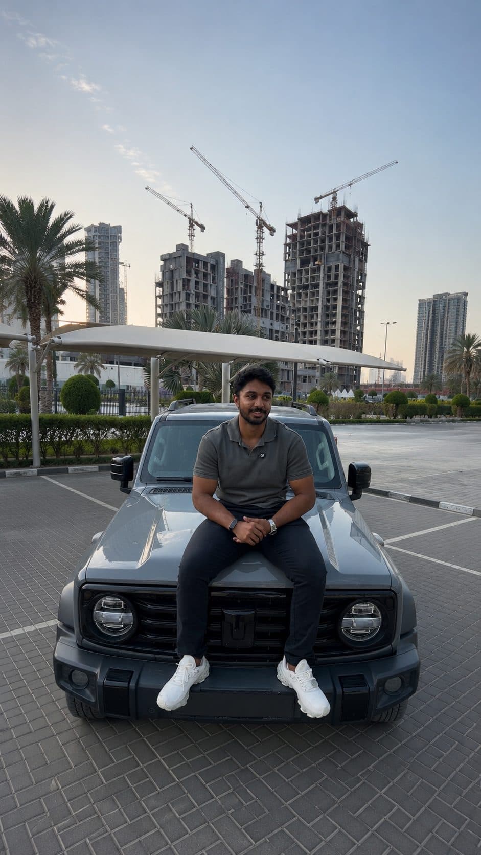 Suhayl on SUV with Dubai skyline